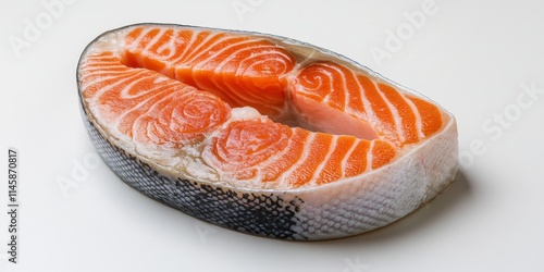 Close up of a salmon steak displayed on a white background, highlighting the vibrant color and texture of the salmon steak, perfect for culinary or food related projects featuring salmon steak. photo