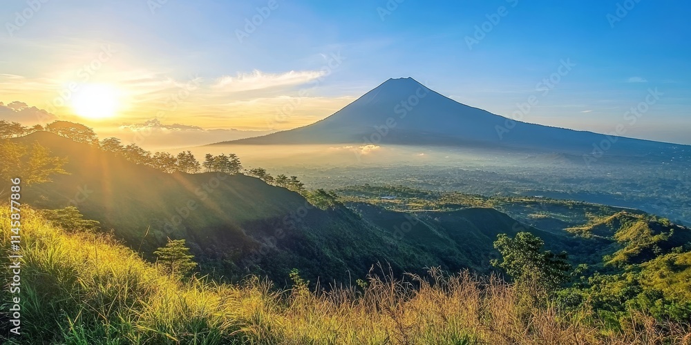 Fototapeta premium Ungaran Mountain shines beautifully under the sun, showcasing its stunning landscapes. The beauty of Ungaran Mountain is particularly captivating on sunny days, making it a perfect view to enjoy.