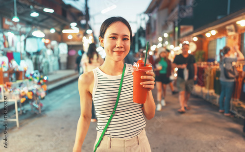Canvas Print Asian foodie woman with watermelon juice travel at night street market, Chiang K