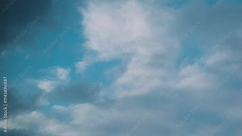 clouds are flying against the background of a clear blue sky clouds are flying against the background of a clear blue sky