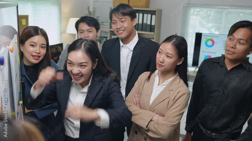 Smiling Asian businessman raising his hands Clapping happily at the table in the office Group of successful Asian business teams discuss cooperation Presentation and analysis of successful reports. Smiling Asian businessman raising his hands Clapping happily at the table in the office Group of successful Asian business teams discuss cooperation Presentation and analysis of successful reports.