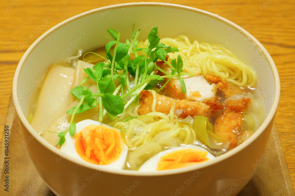 Warm and tasty ramen noodles, with egg, bamboo shoots and chicken cutlet. Warm and tasty ramen noodles, with egg, bamboo shoots and chicken cutlet.