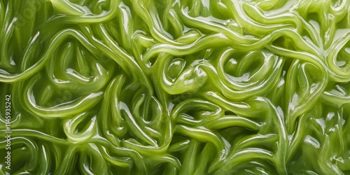 Green bean noodles create an intriguing background texture. The raw funchose and glass noodles form a unique pattern on the surface, showcasing the macro details of these noodles beautifully. photo