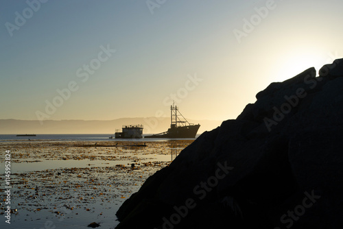 a ship run aground near a beach on the coast of Chile