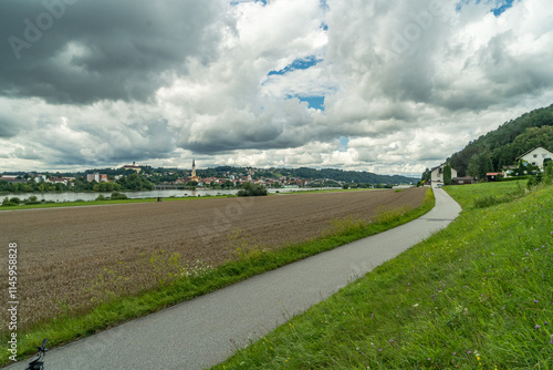 Der Donauradweg in Bayern kurz vor einem Gewitter mit Blick auf Vilshofen photo