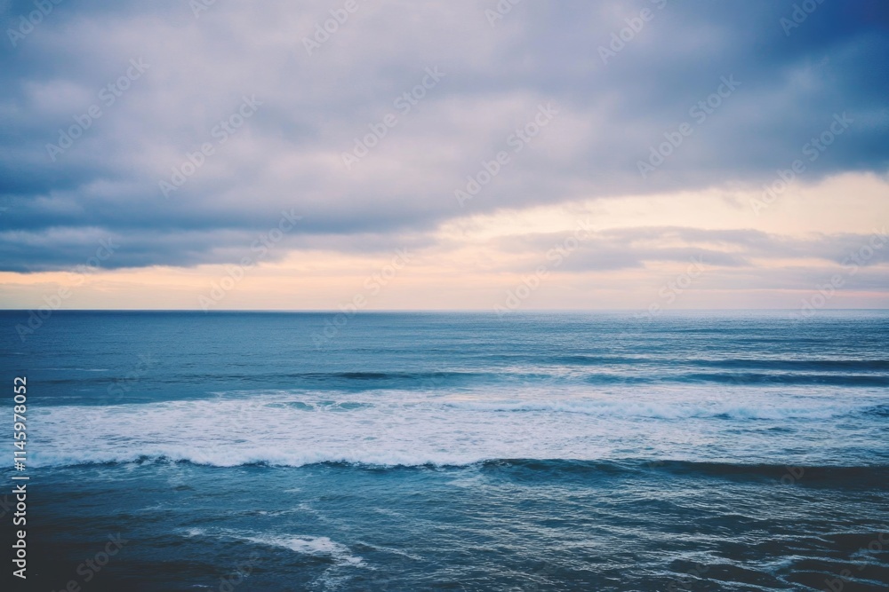 Obraz premium Person on a surfboard in the ocean, having fun