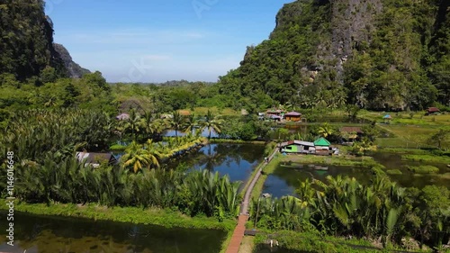 Rammang Rammang Karst Village During Daytime On A Sunny Day In Sulawesi, Indonesia. - aerial shot photo