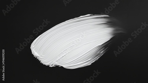 White lotion brush on black background