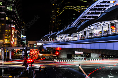 Wallpaper Mural Cross roads.  Night-time traffic light streaks at Chong Nonsi, Bangkok. A walkway is illuminated in the background. Torontodigital.ca