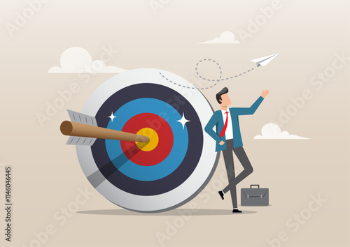 confident businessman stand with arrow hit bullseye on archery target