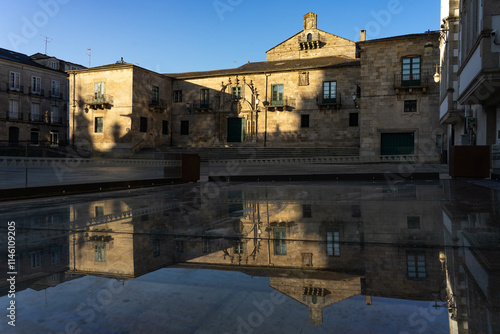 Episcopal Palace in Santa Maria Square in the old town of the fortified city of Lugo at sunset in a sunny day, Galicia, Spain. photo