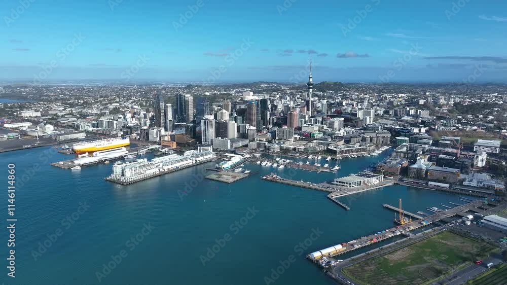 Wide Panoramic Flight Over Auckland and Auckland Bay, New Zealand. Skyline. New Skyscrapers. City Canyon. Aerial Pedestal in Establishing Drone Shot. Wide Panoramic Flight Over Auckland and Auckland Bay, New Zealand. Skyline. New Skyscrapers. City Canyon. Aerial Pedestal in Establishing Drone Shot.