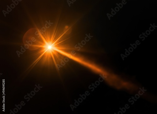 Lens flare of orange light on black background