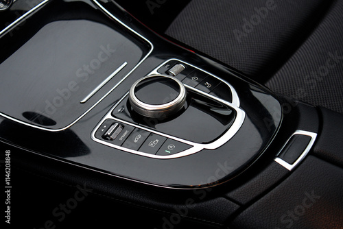 Black Glossy car central control console close-up , modern car central console. Black Leather car interior.