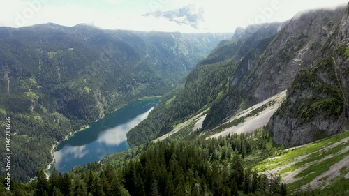 Scenic nature of Austria, forests on the sides of mountains and lake, 4k