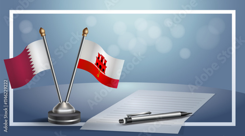 Qatar and Gibraltar National flags on small table with bokeh background, cooperative relationship