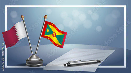 Qatar and Grenada National flags on small table with bokeh background, cooperative relationship