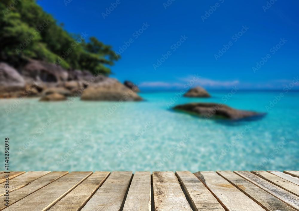 Fototapeta premium Wooden table top on the beach or sea.Party on the beach sunset time concept.For montage product display or design key visual layout.View of copy space.