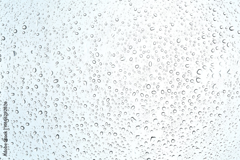 Many water drops on light glass surface, closeup Many water drops on light glass surface, closeup