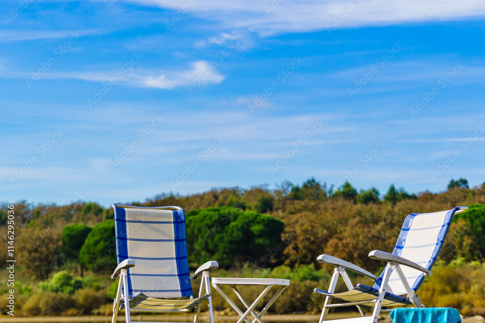 Two empty camp chairs on nature Two empty camp chairs on nature