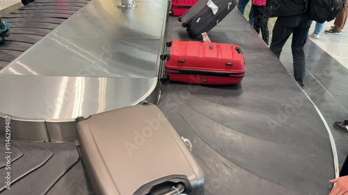 Moving luggage conveyor belt with tourists bags against beautiful sunrise or sunset. No people. Travel vacations beginning concept.