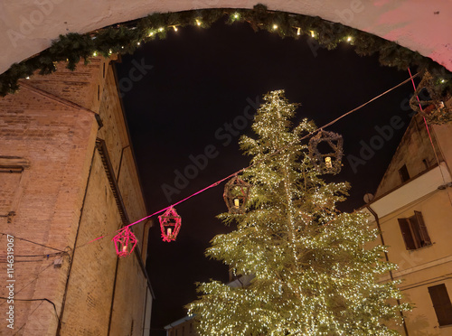 Shining christmas tree in the center of Fossombrone city, Marche region, Italy photo