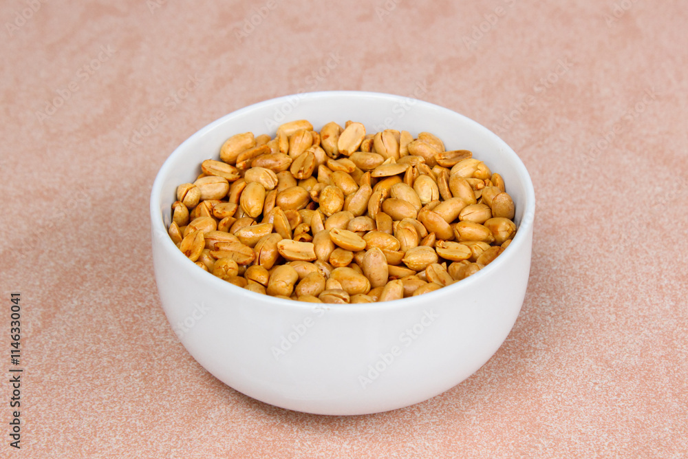 Roasted salted peanut on a white bowl Roasted salted peanut on a white bowl