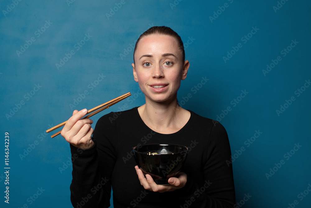 blonde young pretty chef woman with a ramen bowl blonde young pretty chef woman with a ramen bowl