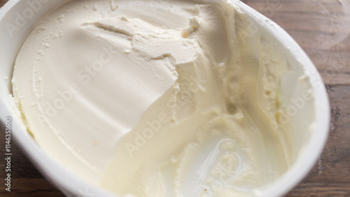 Close-up of cream cheese in a package. Texture of white cream cheese