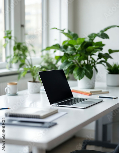 Wallpaper Mural Laptop Computer, notebook, and eyeglasses sitting on a desk in a large open plan office space after working hours Torontodigital.ca
