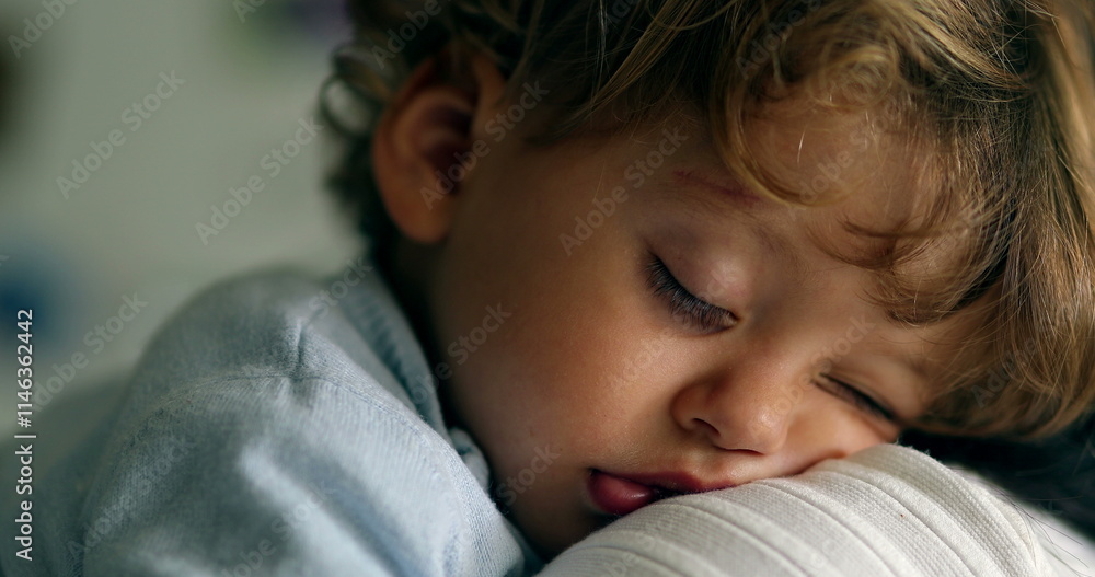 Toddler boy asleep on mother shoulder. Child sleeping. Baby napping Toddler boy asleep on mother shoulder. Child sleeping. Baby napping