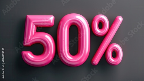 Bright pink 50 percent sign against a dark surface indicating a significant discount or sale event photo