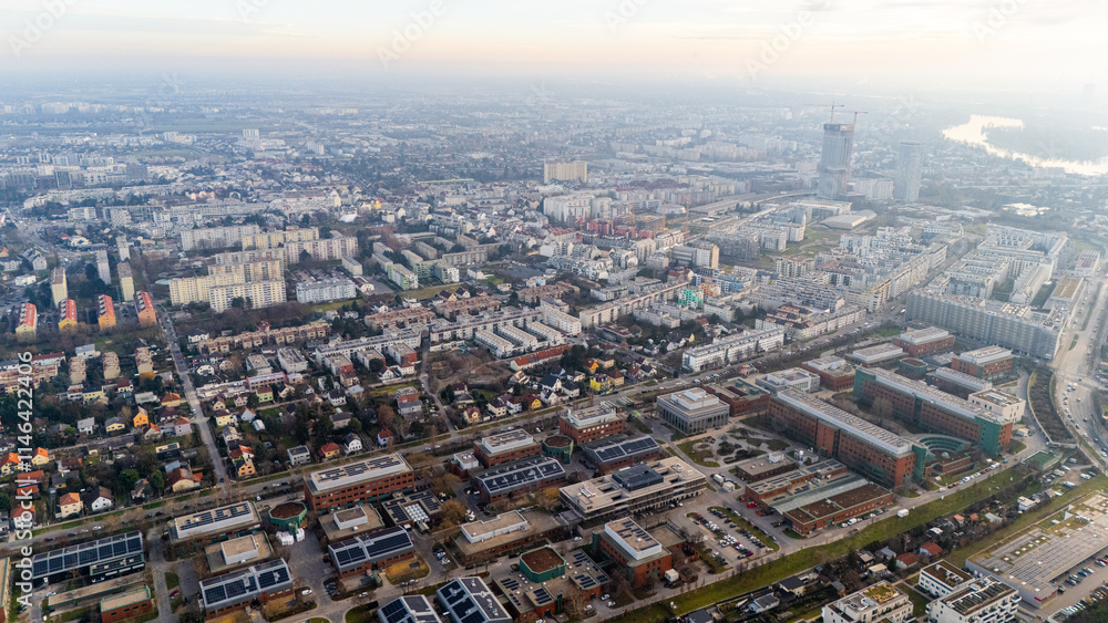 Fototapeta premium Austria, Vienna: Top Aerial View of Quiet Residential Areas in Districts 21 and 22. A peaceful perspective showcasing the serene neighborhoods of the Austrian capital