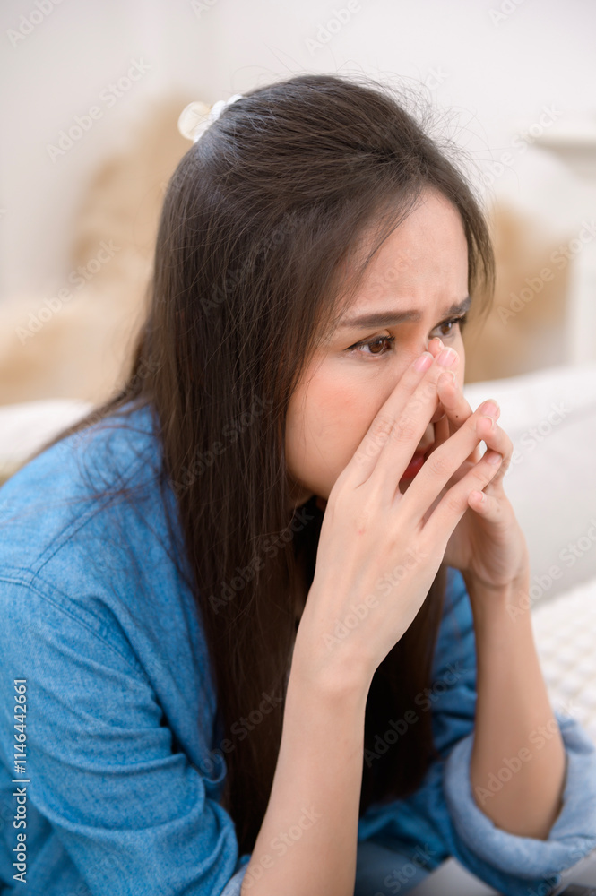 Young asian woman feeling stress in living room at home Young asian woman feeling stress in living room at home