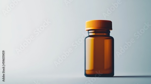 Brown Glass Pill Bottle with Orange Cap on Light Background