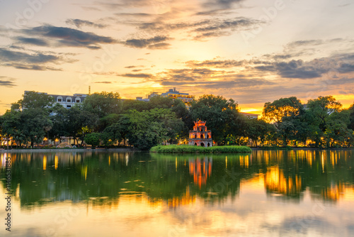 Fototapeta Naklejka Na Ścianę i Meble -  Hoan Kiem Lake ( Ho Guom) or Sword lake in the center of Hanoi in cinematic sunset sky.