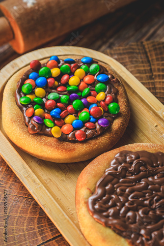 Esfiha or mini pizza with chocolate confetti, m&ms photo