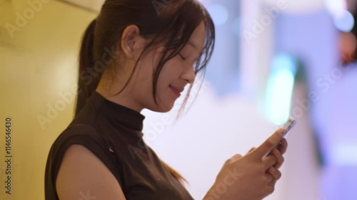 Woman using smartphone at night, Night lights, Bokeh of lights.