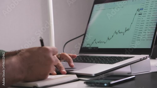 Wallpaper Mural A man is typing on a laptop computer Torontodigital.ca
