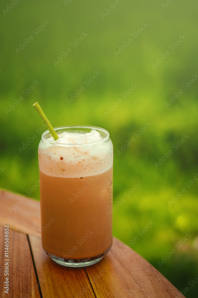 A glass of chocolate milkshake. A glass of chocolate milkshake.