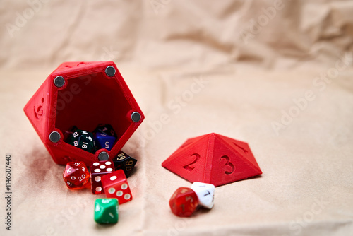 Diverse collection of colored dice on a cardboard surface photo