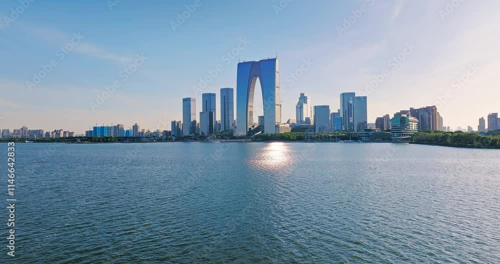 Aerial shot of modern city commercial buildings skyline and lake in Suzhou, China Aerial shot of modern city commercial buildings skyline and lake in Suzhou, China