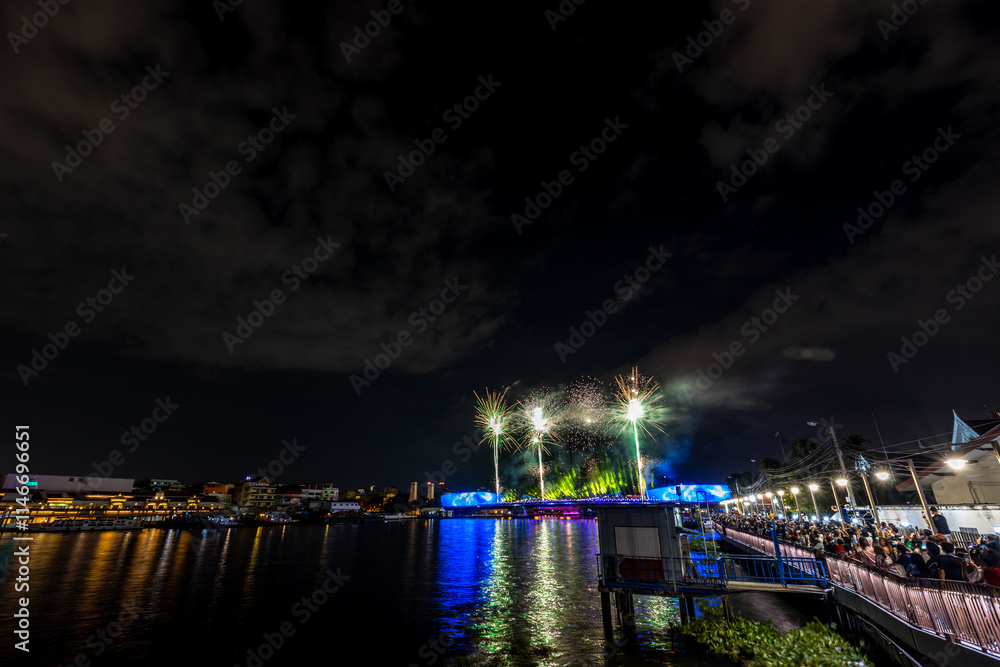 Fototapeta premium The blurred background of fireworks (light trails) is beautiful at night, seen in the New Year holidays, Christmas events, for tourists to take pictures during public travel.