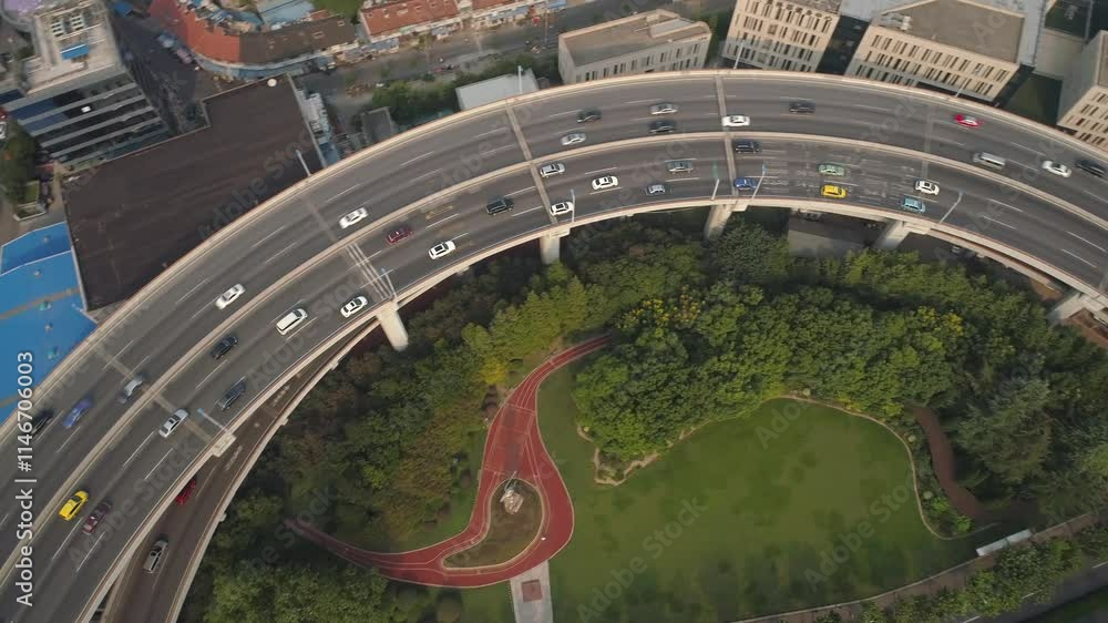 SHANGHAI, CHINA - NOVEMBER 7, 2024: Aerial view of busy highways and green parks showcasing the urban landscape of Shanghai SHANGHAI, CHINA - NOVEMBER 7, 2024: Aerial view of busy highways and green parks showcasing the urban landscape of Shanghai