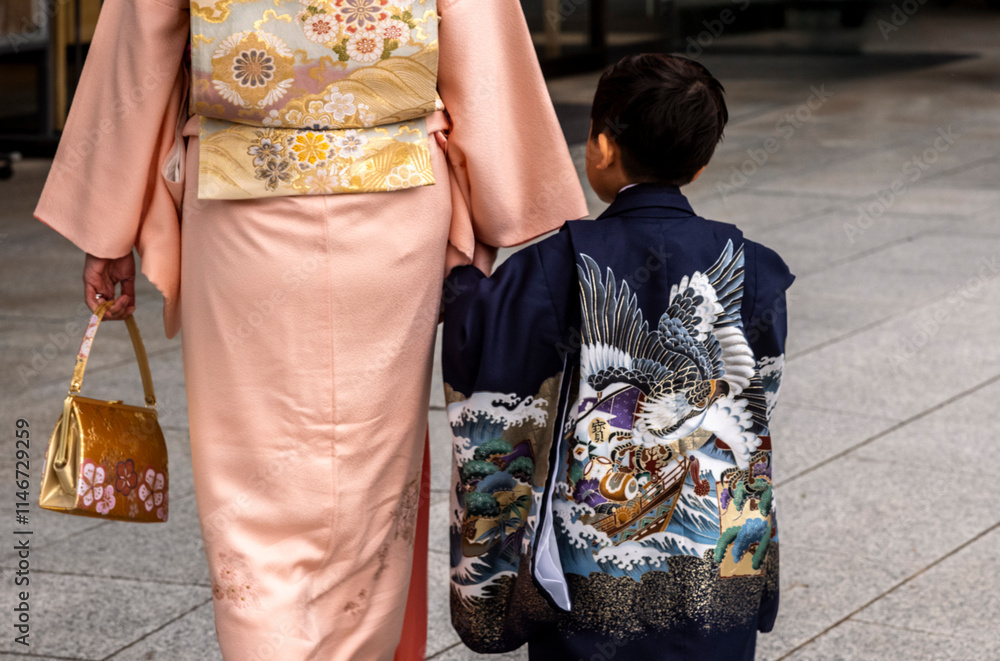 Mother and son dressed in traditional Japanese costume holding hands Mother and son dressed in traditional Japanese costume holding hands