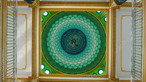 Symmetrical photo shot of the interior of the mosque dome