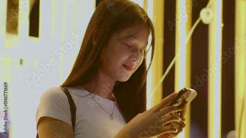 Woman using smartphone at night, Night lights, Bokeh of lights.