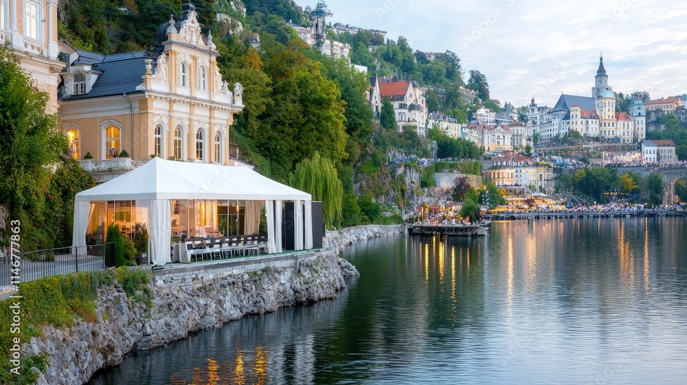 Obraz premium Lakeside villa with event tent at dusk.