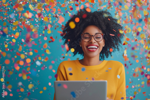 woman is smiling and holding a laptop in front of a colorful background. Concept of joy and excitement, possibly related to a celebration or a happy moment photo