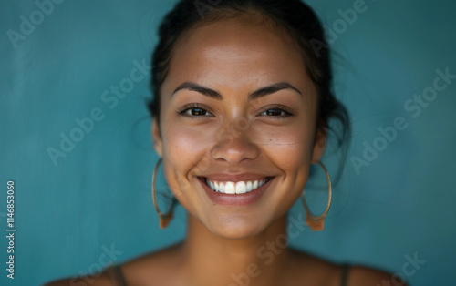 A natural portrait of a woman mid-laughter, showcasing carefree spirit photo